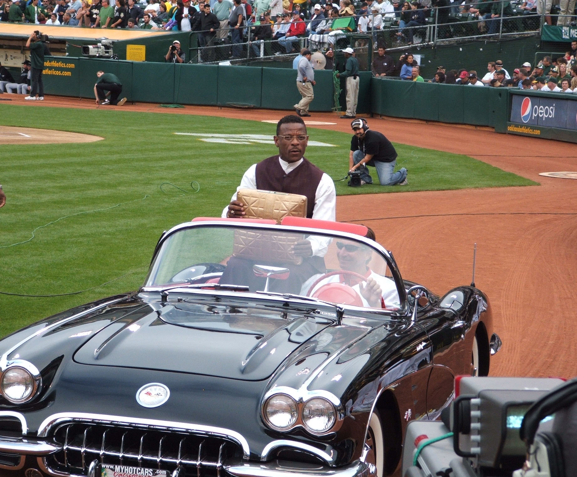 Rickey riding in car with gold base - cropped.jpg